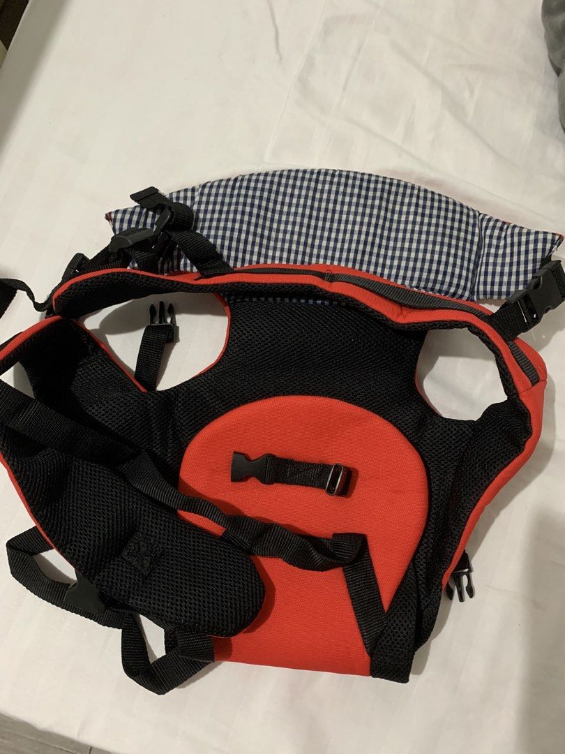 Brahm Baby Carrier Red and Black (Category: Carriers & Slings) located in Antipolo. Submitted by franc09 (Listing ID 1470383334, Image 2). Description: - Brand: Brahm Baby Carrier - Color: Red and black with blue and white gingham check head support flap - Comfort: Breathable mesh panels inside for extra ventilation - Fit & Safety: Fully adjustable straps and secure plastic buckles - Condition: Brand new without tag. RFS: Gift kay baby nung baby 