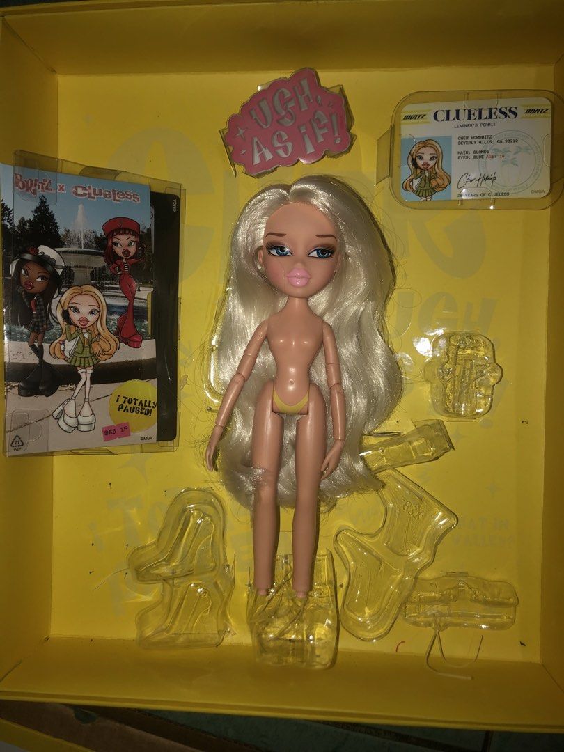 Bratz x Clueless Cher (Category: Kids Toys) located in Angeles City. Submitted by bratzdylan (Listing ID 1470555545, Image 1). Description: - Brand: Bratz x Clueless Collection - Character: Cher Horowitz - Features: Long blonde hair, blue eyes, and pink lips - Inclusions: Original yellow plaid box, accessories, mini ID card, and booklet - Condition: Great collector's item; box window has minor edge wear, inner plastic shell is intact.