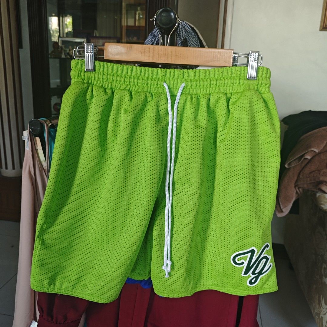 Bright Green Mesh Athletic Shorts with White Drawstring and VG Logo (Category: Shorts) located in Iloilo. Submitted by teezeewhyyy (Listing ID 1470445313, Image 1). Description: - Color: Bright Green - Material: Breathable athletic mesh fabric - Fit: Elastic waistband with adjustable white drawstring - Detail: Embroidered white 'VG' logo outlined in green on the bottom right leg - Versatility: Ideal for workouts, gym sessions, lounging, or casual