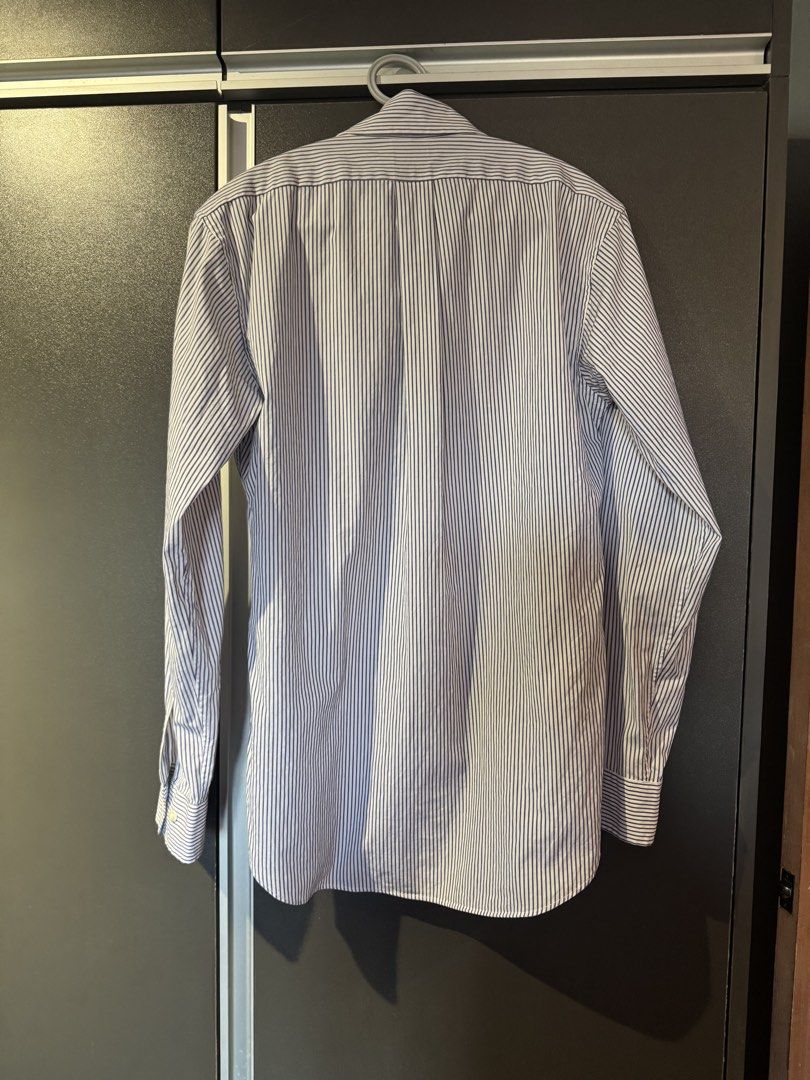 Brooks Brothers Blue Striped Button Down Shirt Size 0 (Category: Tshirts & Polo Shirts ) located in Dasmarinas. Submitted by akelvin23 (Listing ID 1470430518, Image 3). Description: - Brand: Brooks Brothers - Color/Pattern: Blue and white stripes - Fit/Style: Semi-fitted stretch, button front with chest pocket - Material: 96% cotton, 4% lastol - Details: Crisp collar, long sleeves with button cuffs - Condition: Clean inside and out, ready to wear
