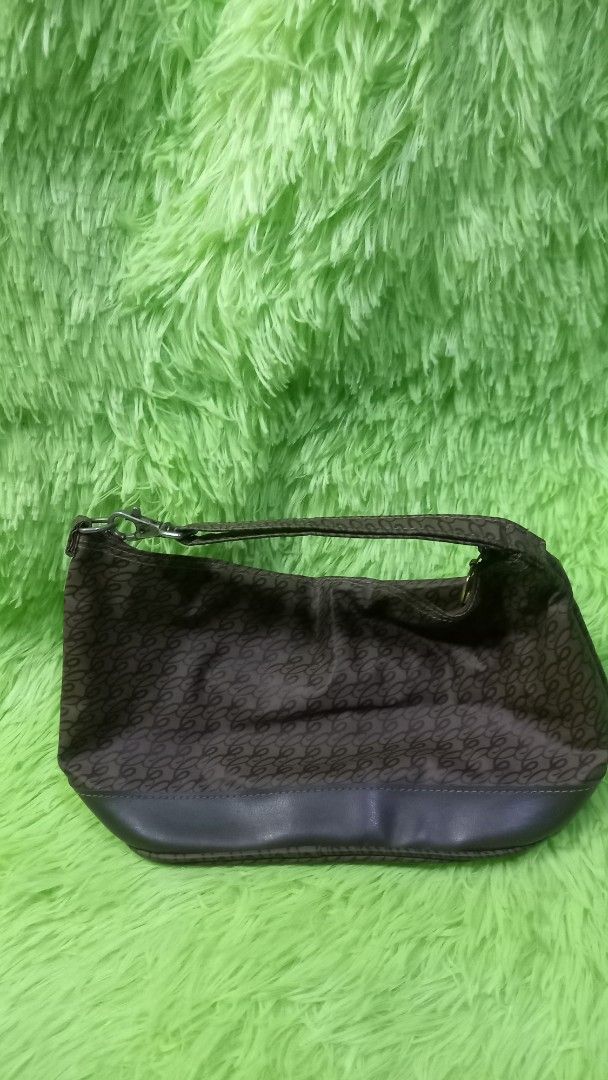 Brown Monogram Pattern Shoulder Bag with Leather Trim (Category: Shoulder Bags) located in Manila. Submitted by twinklelyn03 (Listing ID 1470417238, Image 2). Description: - Stylish brown monogram pattern with solid dark brown trim - Compact and lightweight daily shoulder bag - Secure zip-top closure - Features an interior pocket for better organization - Clean fabric lining inside - Ideal size for your phone, keys, and daily essentials see photo