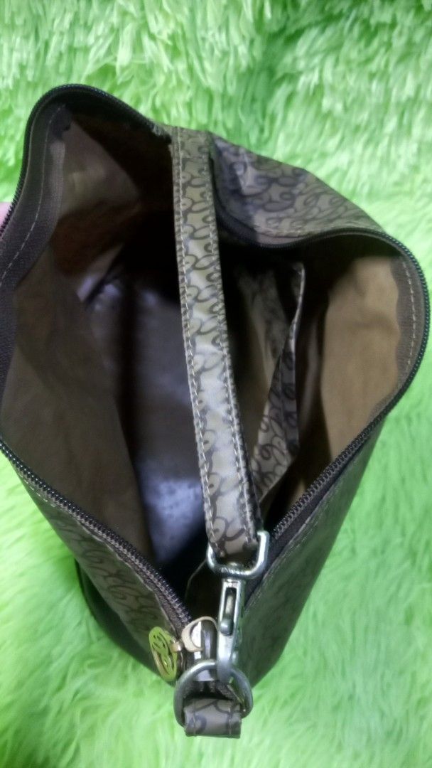 Brown Monogram Pattern Shoulder Bag with Leather Trim (Category: Shoulder Bags) located in Manila. Submitted by twinklelyn03 (Listing ID 1470417238, Image 3). Description: - Stylish brown monogram pattern with solid dark brown trim - Compact and lightweight daily shoulder bag - Secure zip-top closure - Features an interior pocket for better organization - Clean fabric lining inside - Ideal size for your phone, keys, and daily essentials see photo
