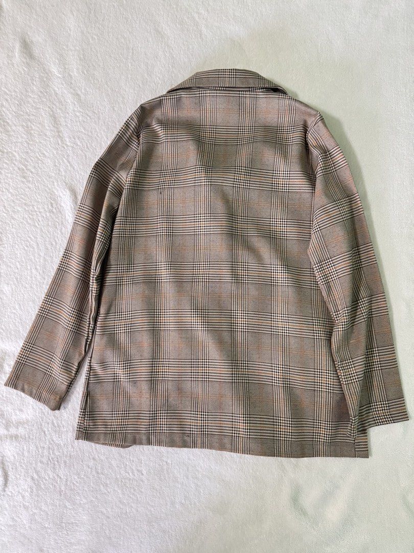Brown Plaid Double Breasted Blazer Jacket (Category: Coats, Jackets and Outerwear) located in Manila. Submitted by mmilaomls (Listing ID 1470404791, Image 2). Description: - Style: Double-breasted blazer with lapel collar - Pattern/Color: Brown and black plaid - Features: Two front pockets, easy to layer - Measurements (laid flat): Pit-to-pit 18.5", Length 27", Sleeves 22" - Occasion: Perfect for workwear or casual outings.