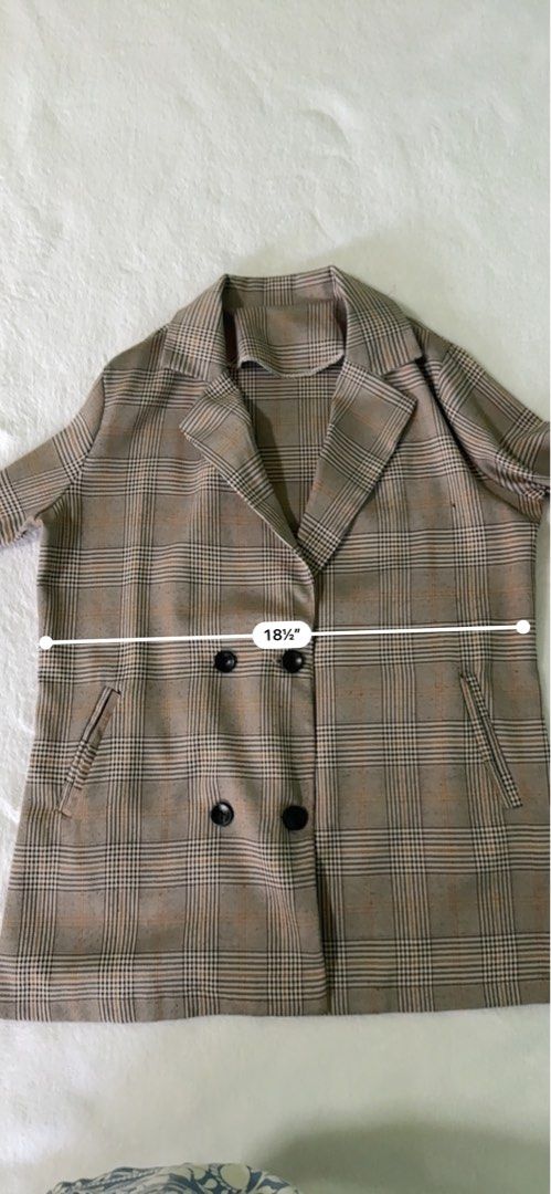 Brown Plaid Double Breasted Blazer Jacket (Category: Coats, Jackets and Outerwear) located in Manila. Submitted by mmilaomls (Listing ID 1470404791, Image 3). Description: - Style: Double-breasted blazer with lapel collar - Pattern/Color: Brown and black plaid - Features: Two front pockets, easy to layer - Measurements (laid flat): Pit-to-pit 18.5", Length 27", Sleeves 22" - Occasion: Perfect for workwear or casual outings.