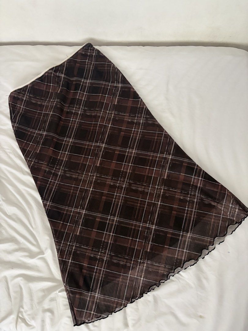 Brown plaid mesh skirt (Category: Skirts) located in Las Pinas. Submitted by thriftedfinds_ (Listing ID 1470354884, Image 1). Description: - Style: Brown plaid mesh midi skirt - Details: Lettuce hem trim, fully lined - Size: Large - Material: 94% polyester, 6% elastane - Origin: Made in China.