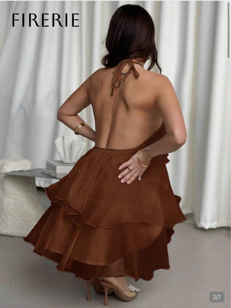 Brown Tiered Halter Mini Dress (Category: Dresses) located in Makati City. Submitted by lemoneyeddd (Listing ID 1470496693, Image 2). Description: - Brand: Shein - Color: Brown with a shimmering finish - Style: Tiered halter mini dress with an open back and multiple ruffles - Fit: Super cute and flowy - Condition: Used thrice, has flaw (see the the last slide) - Perfect for: Beach trips, pool days, and vacations - Mode of Payment: GCash, BPI, Mar