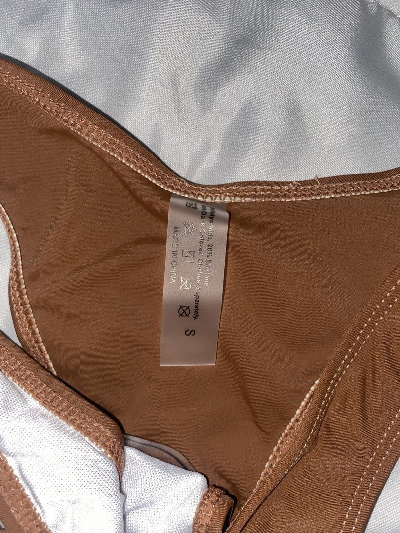 Brown Two Piece Underwire Bikini Set Size S (Category: Bikinis & Swimsuits) located in Bacoor. Submitted by zzallys (Listing ID 1470511711, Image 2). Description: - Color: Brown - Size: S (tag attached) - Style: Two-piece bikini set - Top: Underwire, adjustable straps, and back clasp closure - Bottoms: Cheeky coverage - Material: 80% polyamide, 20% elastane - Care: Wash dark colors separately - Condition: Brand new.