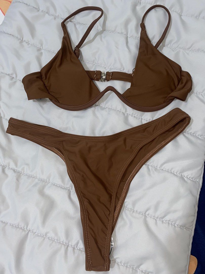 Brown Two Piece Underwire Bikini Set Size S (Category: Bikinis & Swimsuits) located in Bacoor. Submitted by zzallys (Listing ID 1470511711, Image 1). Description: - Color: Brown - Size: S (tag attached) - Style: Two-piece bikini set - Top: Underwire, adjustable straps, and back clasp closure - Bottoms: Cheeky coverage - Material: 80% polyamide, 20% elastane - Care: Wash dark colors separately - Condition: Brand new.