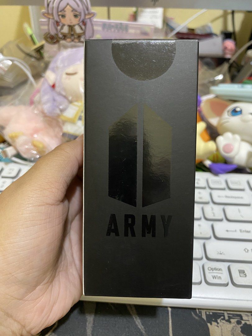 BTS Official Light Stick Keyring Ver.4 (Category: K-Wave Merchandise) located in Imus. Submitted by mnmv23 (Listing ID 1470532167, Image 1). Description: Official BTS light stick keyring version 4 by Big Hit Music and Hybe. Black box packaging with Army logo detailing. Requires LR44 button cell batteries, nominal voltage 1.5V x 3. Manufactured in South Korea. Compact size measuring 5 x 11.98cm..