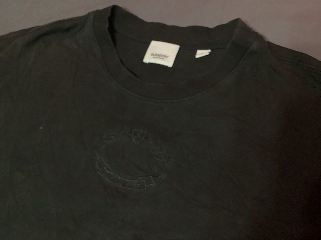 Burberry Black T-shirt (Category: Tshirts & Polo Shirts ) located in Davao. Submitted by ferdipt (Listing ID 1470369874, Image 1). Description: Excellent Condition Made in Italy Size L L:27 inches Armpit to Armpit:23 inches 100% Cotton.