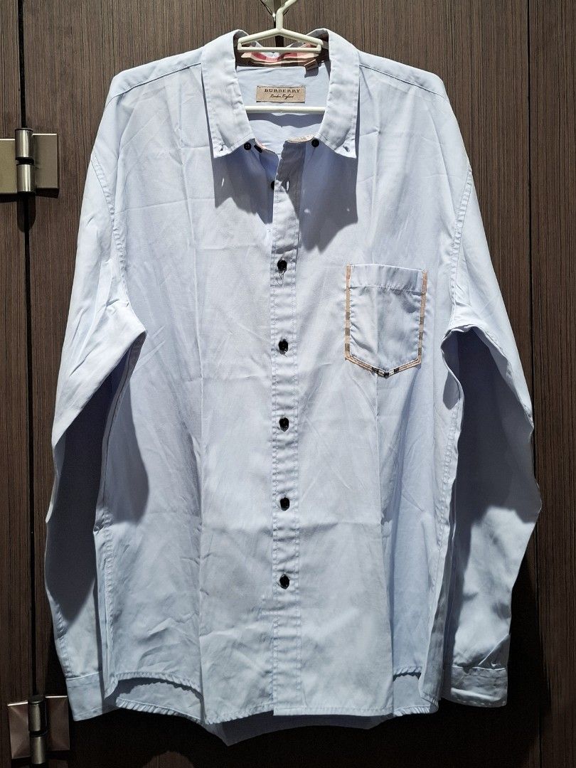 Burberry Check Detail Button-Down Shirt (Guaranteed Authentic) (Category: Formal Shirts) located in Pasig City. Submitted by coveted.mnl (Listing ID 1470440927, Image 2). Description: Guaranteed Authentic📌 Needs ironing only🤍 Best fit to: Xl Width : 23 Length : 29 (MEASURED BY INCHES) 9.5/10 overall condition No issues or flaws in fabric Retailed for $295 (P18,585) • P1,400 Slightly negotiable • Pasig City meet up • Open for COD Via Lalamove or