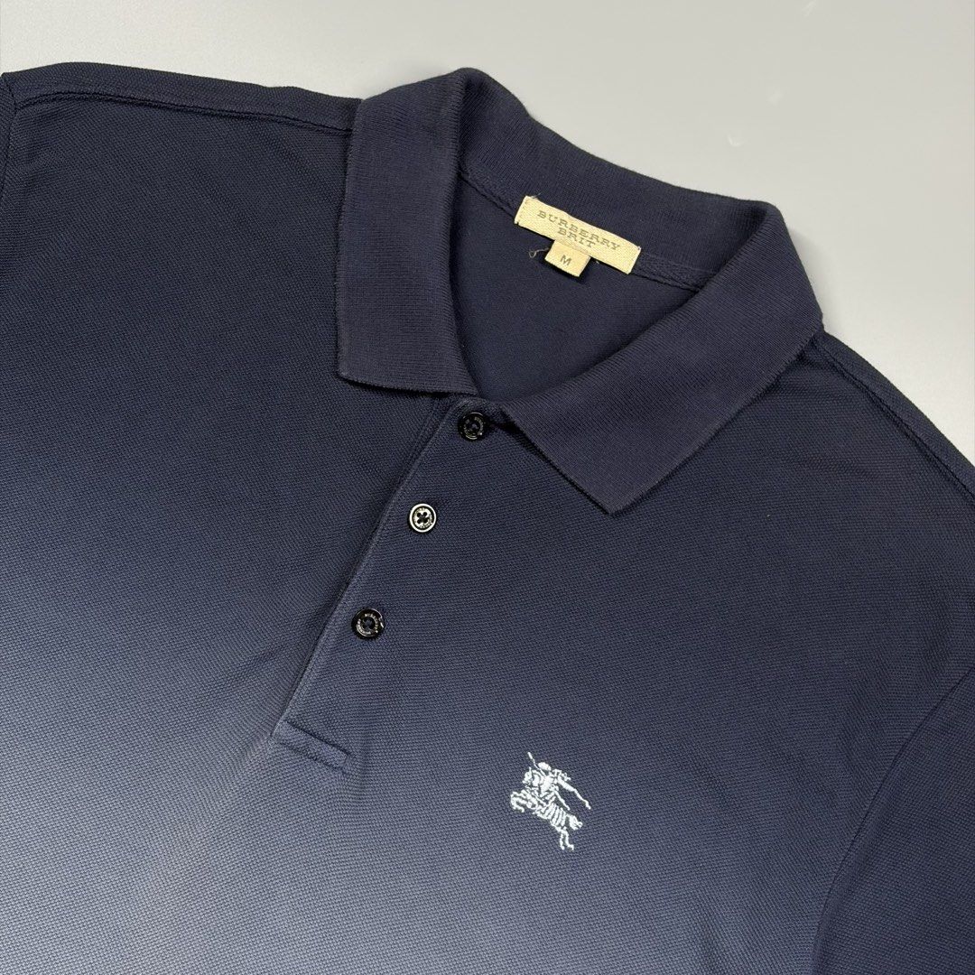Burberry Dip Dye Poloshirtb(Authentic) (Category: Luxury Apparel) located in Cavite. Submitted by onebeancent (Listing ID 1470457275, Image 3). Description: Size: Medium Dimension: 19" Width | 28" Length Color: Navy Blue & Sky Blue Color Rate: 9.8/10 Issue: None Condition: Like new‼️ Price: 1,280php Additional Shipping Fee (J&T Small Pouch) 75php Luzon 100php visayas 120php mindanao.