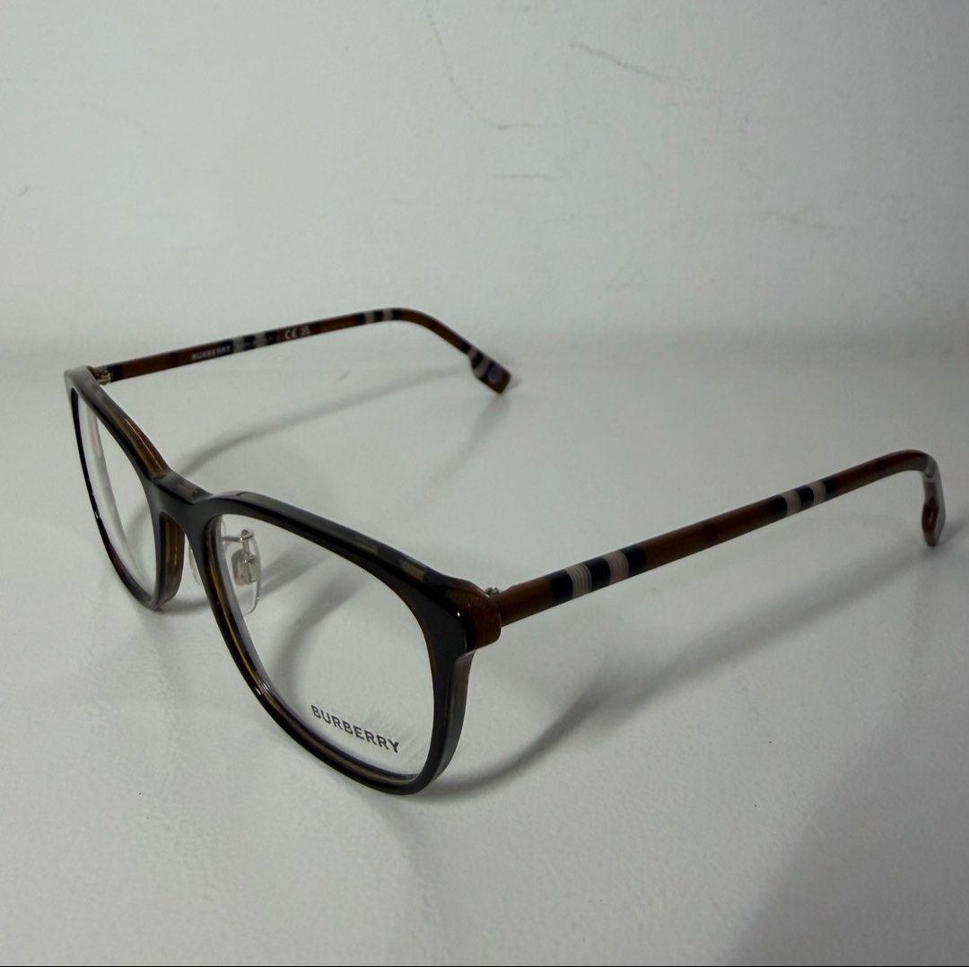 Burberry Prescription Eyeglasses (Category: Sunglasses & Eyewear) located in Manila. Submitted by importgoodiesph (Listing ID 1470483467, Image 3). Description: Burberry B2371-D Brown Burberry Pattern Frame Eyeglasses - in excellent unused condition - unisex - dimensions: 53-18-140 - material: acetate - made in Italy - comes with box, leather case, authenticity certificate, cleaning cloth, Luxottica card LBC shipping c/o buyer..