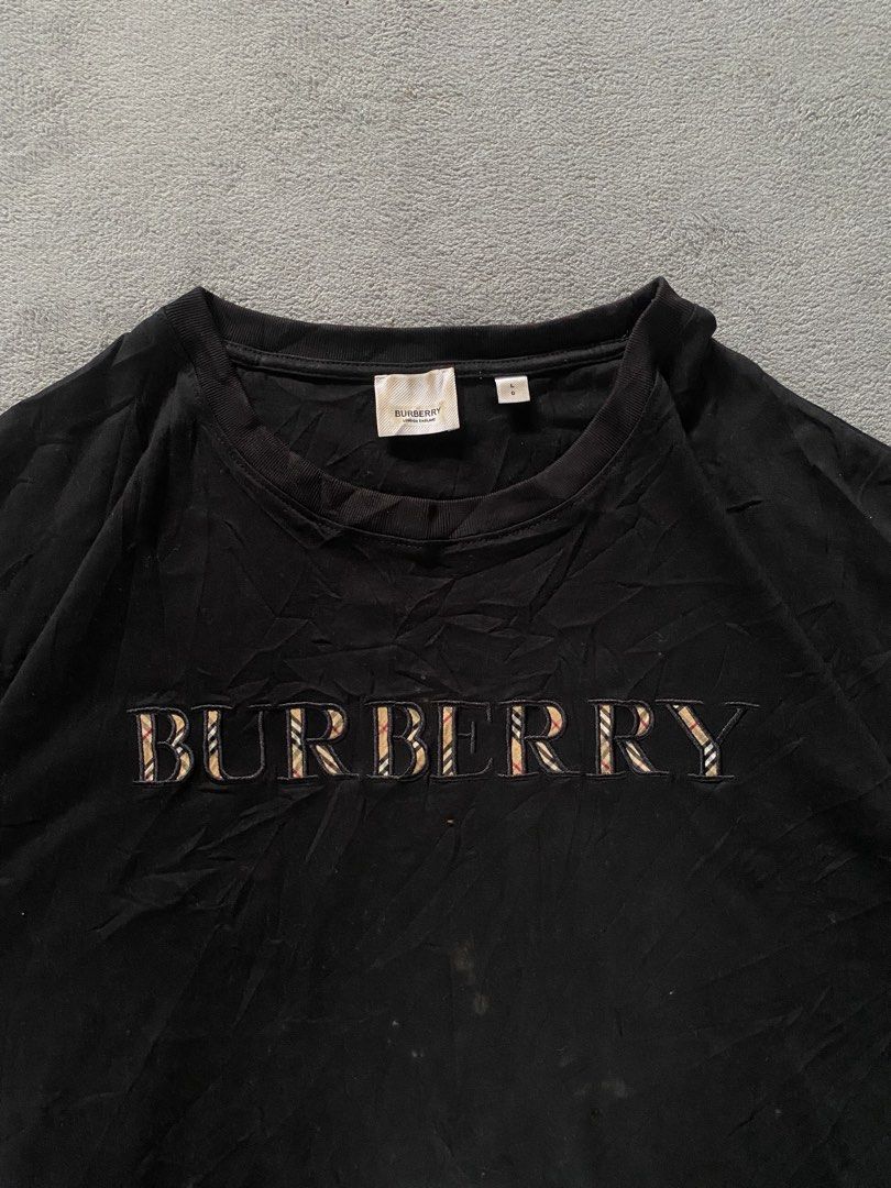 Burberry Script Shirt (Category: Tshirts & Polo Shirts ) located in Ozamiz City. Submitted by thriftnikael (Listing ID 1470511902, Image 3). Description: width: 23 length: 27.5 size: large on tag best fit xl Color rate: 9/10 Condition: 9/10 Issue: slight fade sa neck .