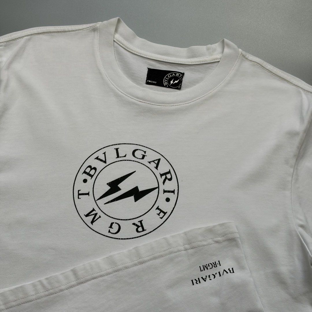 Bvlgari x Fragment (Authentic) (Category: Luxury Apparel) located in Cavite. Submitted by onebeancent (Listing ID 1470557235, Image 3). Description: Size: S to M (Men) | Large (Women's) Dimension: 19" Width | 26" Length Color: White Color Rate: 9.5/10 Issue: Hairline crack on print Condition: Excellent overall Price: 880php Additional Shipping Fee (J&T Small Pouch) 75php Luzon 100php visayas 120php mindanao.