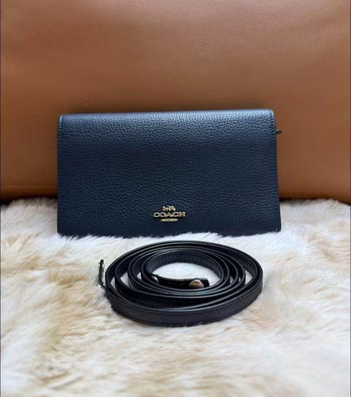C0ach Crossbody (Category: Purses & Pouches) located in Manila. Submitted by annafinds (Listing ID 1470384930, Image 1). Description: Authentic C0ach Crossbody in a black leather with gold-tone hardware and a detachable strap. - In excellent condition ₱7,999 Open for layaway..