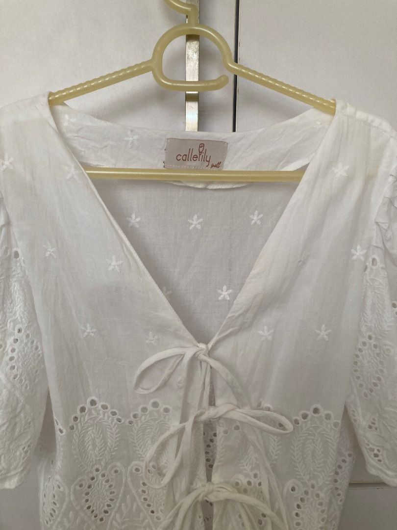 Callelily White Eyelet Linen Tie-Front Crop Top (Worn Once) (Category: Others Tops) located in Quezon City. Submitted by ingga_preloved (Listing ID 1470350608, Image 3). Description: Selling this gorgeous, authentic Callelily white eyelet linen crop top! ✨ Only worn once for a quick photo/event, so it’s still in pristine, like-new condition with absolutely no stains, holes, or frayed threads. Perfect for beach trips, brunch dates, or casual boho-