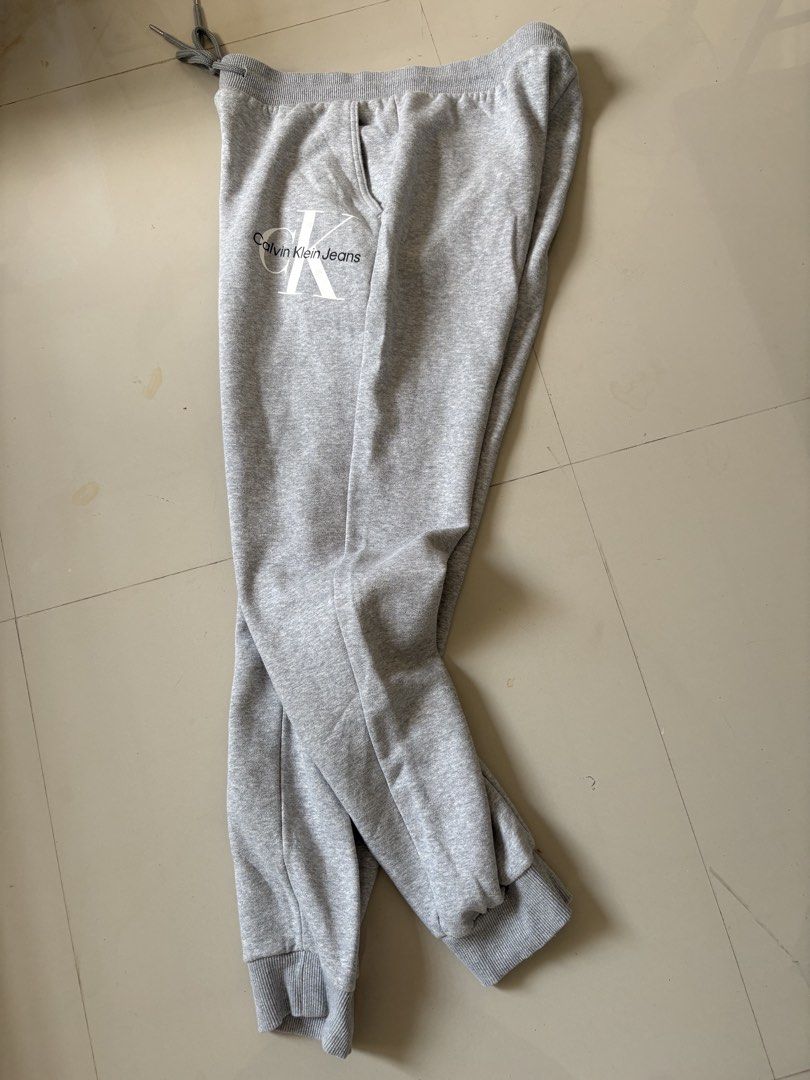 Calvin Klein Monogram Logo Fleece Joggers (Category: Joggers) located in General Santos City (Dadiangas). Submitted by a.rt.eyes (Listing ID 1470409950, Image 2). Description: Calvin Klein Monogram Logo Fleece Joggers Size large on tag Actual waistline 32-36, stretchable Length 41 Excellent condition with no issues Color rate 10/10 Original Located in General Santos City, Mindanao. Shipping fee applies for buyers outside my location. Payment firs