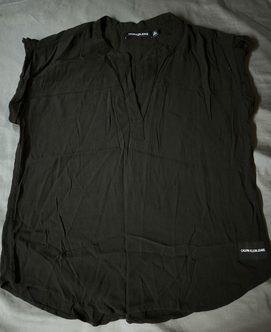 Calvin Klein plain blouse (Category: Blouses) located in Manila. Submitted by wearforce (Listing ID 1470495311, Image 1). Description: Calvin Klein plain blouse color: black fit: M-L color rate 9/10 in good condition 350 + sf.