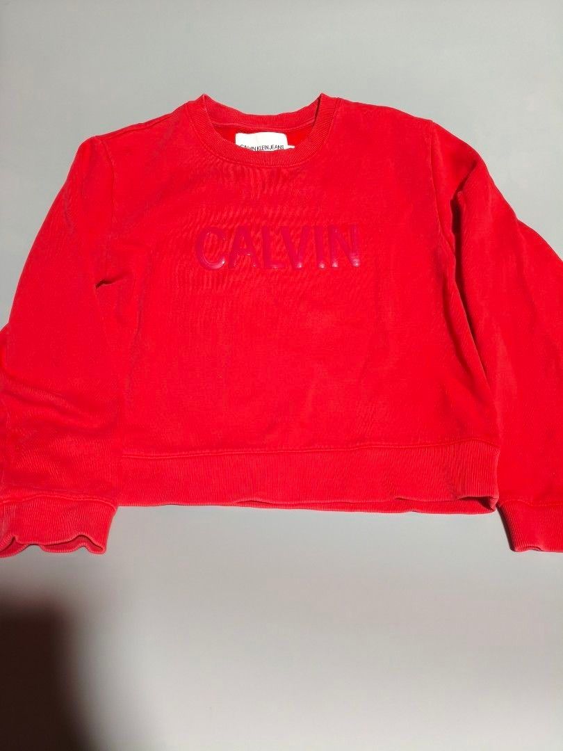 Calvin Klein Red Sweatshirt (Category: Coats, Jackets and Outerwear) located in Pasig City. Submitted by tobyrama (Listing ID 1470537452, Image 1). Description: ✔️ Brand: Calvin Klein Jeans ✔️ Design: Long Sleeve Shirt ✔️ Color: Red ✔️ Size: Medium (on tag) ✔️ Condition: Almost New it has washable stains ✔️ Dimensions: length: 20 inches width: 20 inches sleeves length: 22 inches sleeves width: 4 inches Can do J&T shipping or Lalamove for same day
