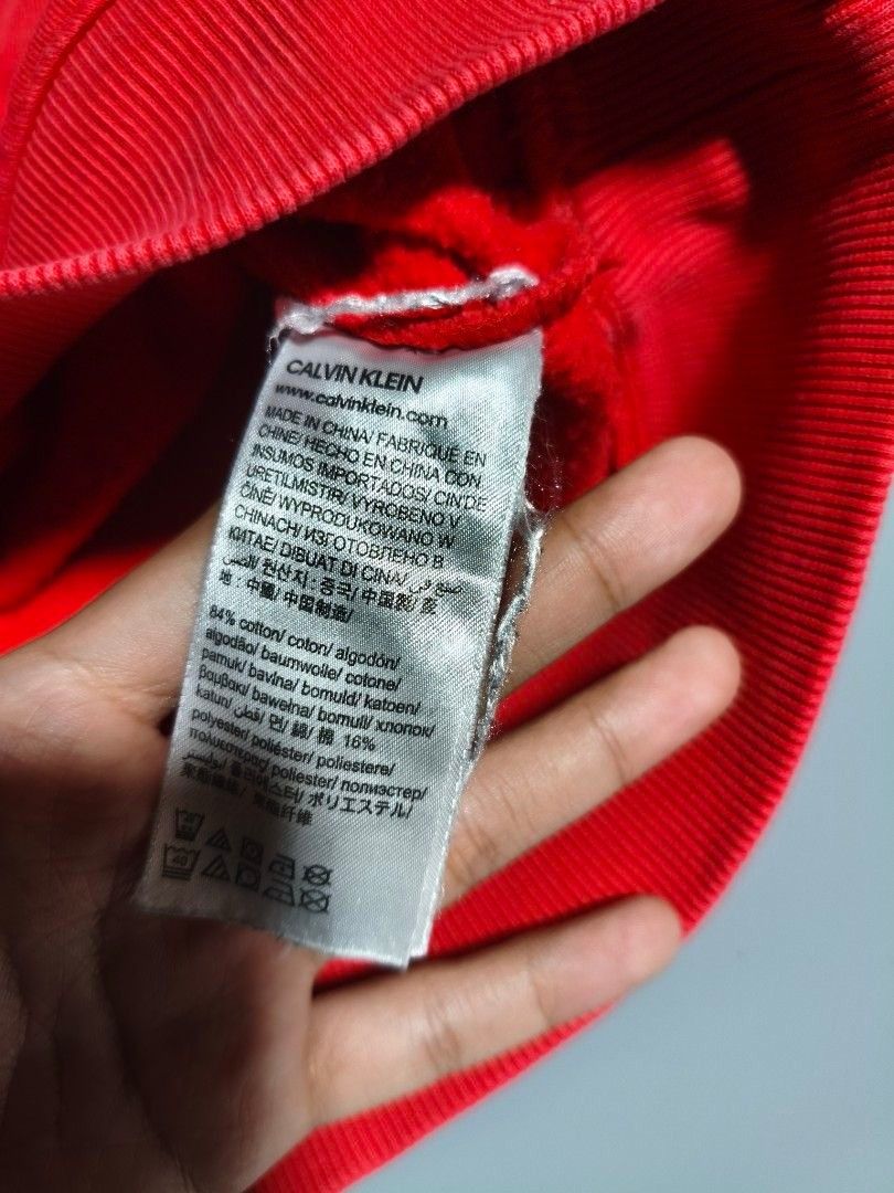 Calvin Klein Red Sweatshirt (Category: Coats, Jackets and Outerwear) located in Pasig City. Submitted by tobyrama (Listing ID 1470537452, Image 3). Description: ✔️ Brand: Calvin Klein Jeans ✔️ Design: Long Sleeve Shirt ✔️ Color: Red ✔️ Size: Medium (on tag) ✔️ Condition: Almost New it has washable stains ✔️ Dimensions: length: 20 inches width: 20 inches sleeves length: 22 inches sleeves width: 4 inches Can do J&T shipping or Lalamove for same day