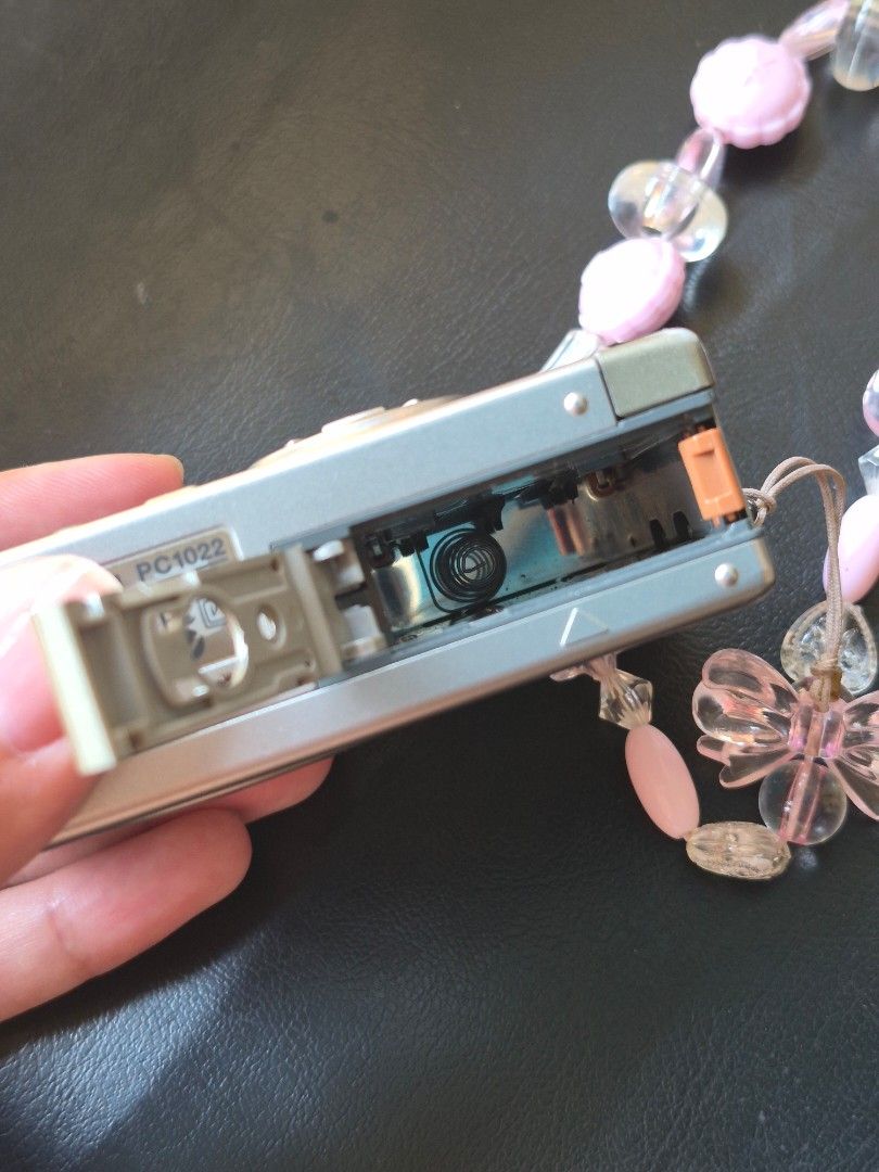 Canon PowerShot S200 Digital ELPH Compact Camera (Category: Cameras) located in Manila. Submitted by its_geliiii (Listing ID 1470392006, Image 3). Description: FOR SALE: Canon PowerShot S200 Digital ELPH — DEFECTIVE / FOR REPAIR Selling my Canon PowerShot S200 Digital ELPH, 2MP vintage digital camera. **Condition and issues:** * Powers on and lens extends normally * LCD menu displays properly * Previously saved photos can be viewed * Live view is