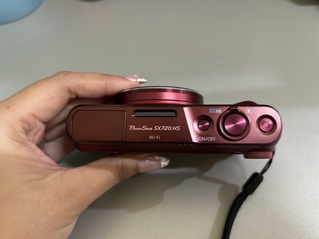 Canon PowerShot SX720 HS Red Digital Camera (Category: Cameras) located in Caloocan City. Submitted by rigellll (Listing ID 1470483844, Image 2). Description: **Canon SX720 HS | 20.3MP | 40x Optical Zoom 📸** **KEY FEATURES** * 20.3MP CMOS Sensor * 40x Optical Zoom — perfect for travel and distant shots * Built-in Wi-Fi & NFC for easy photo transfers * Full HD 1080p Video Recording * Compact and lightweight — easy to bring anywhere **CONDITION** 