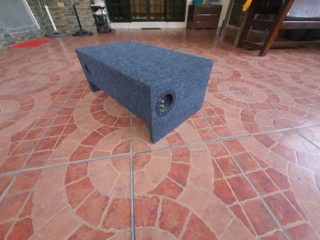 Car Audio Subwoofer in Custom Box Enclosure (Category: Soundbars, Speakers & Amplifiers) located in Dasmarinas. Submitted by njgatchi (Listing ID 1470518645, Image 3). Description: - Custom enclosure with built-in car subwoofer speaker - Sturdy grey carpeted wooden box housing - Convenient side terminal cup connections - Speaker cone features a central logo on the dust cap - Fully wired and ready for immediate vehicle audio setup - Solid build de