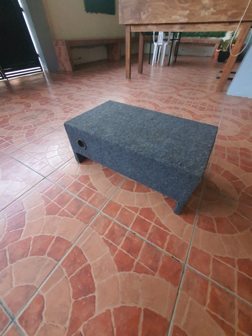 Car Audio Subwoofer in Custom Box Enclosure (Category: Soundbars, Speakers & Amplifiers) located in Dasmarinas. Submitted by njgatchi (Listing ID 1470518645, Image 1). Description: - Custom enclosure with built-in car subwoofer speaker - Sturdy grey carpeted wooden box housing - Convenient side terminal cup connections - Speaker cone features a central logo on the dust cap - Fully wired and ready for immediate vehicle audio setup - Solid build de