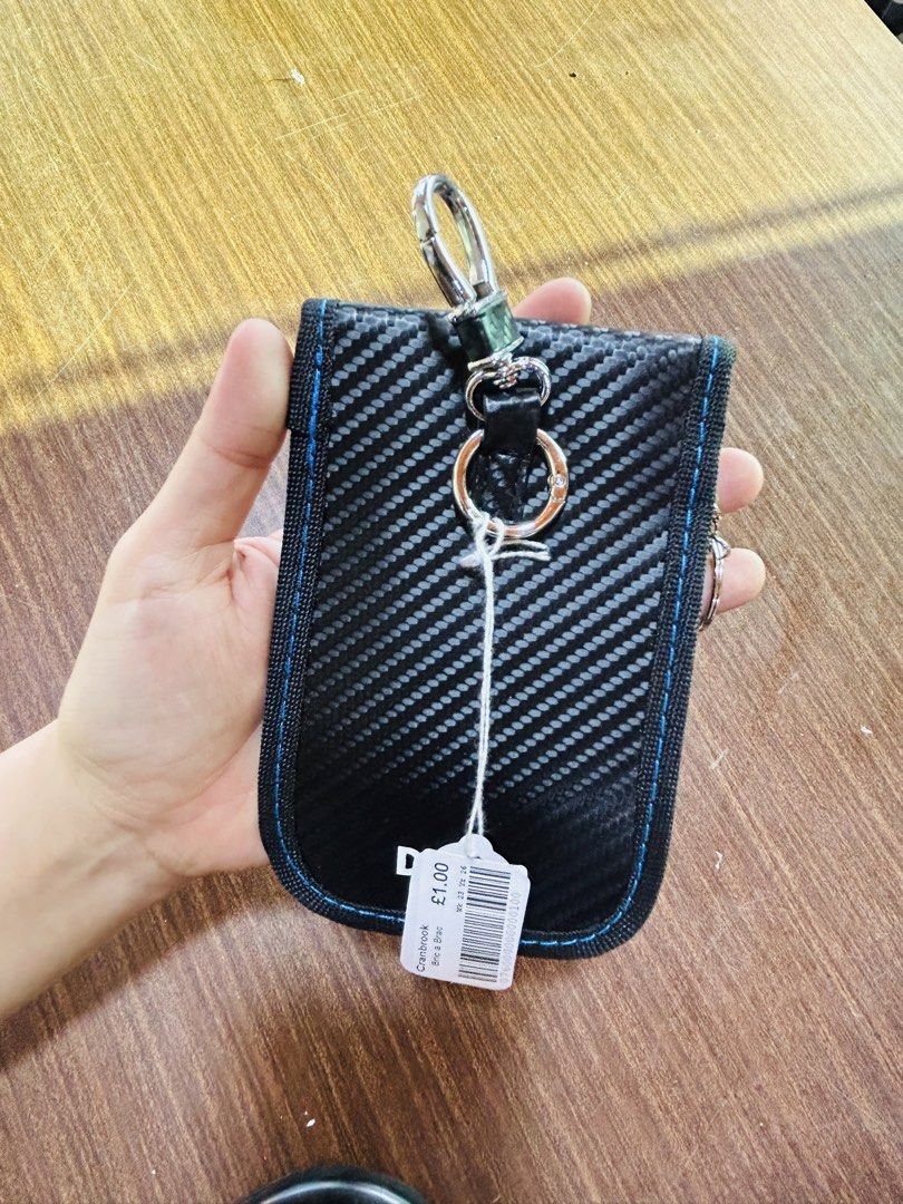 Carbon fiber pattern coin pouch key holder keychain (Category: Purses & Pouches) located in Manila. Submitted by starbalesukandjapansurplus (Listing ID 1470555345, Image 2). Description: - Stylish black carbon fiber weave design with contrast blue stitching - Secure flap closure with hook and loop fastener - Convenient top hook clip for easy attachment to bags or belt loops - Built-in key ring and internal silver metallic lining with an attached 
