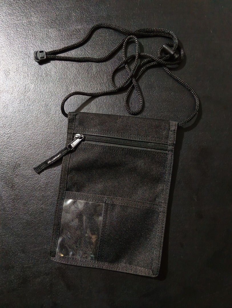 Carhartt WIP Collins Neck Pouch Black (Category: Belt bags, Clutches and Pouches) located in Manila. Submitted by fgkamiseta_2nd (Listing ID 1470461539, Image 2). Description: - Brand: Carhartt WIP Collins neck pouch - Color: Classic black canvas - Strap: Adjustable cord strap with secure toggle closure - Compartments: Main zip compartment, clear back card slot, and front flap with velcro closure - Branding: Authentic Carhartt square label on the