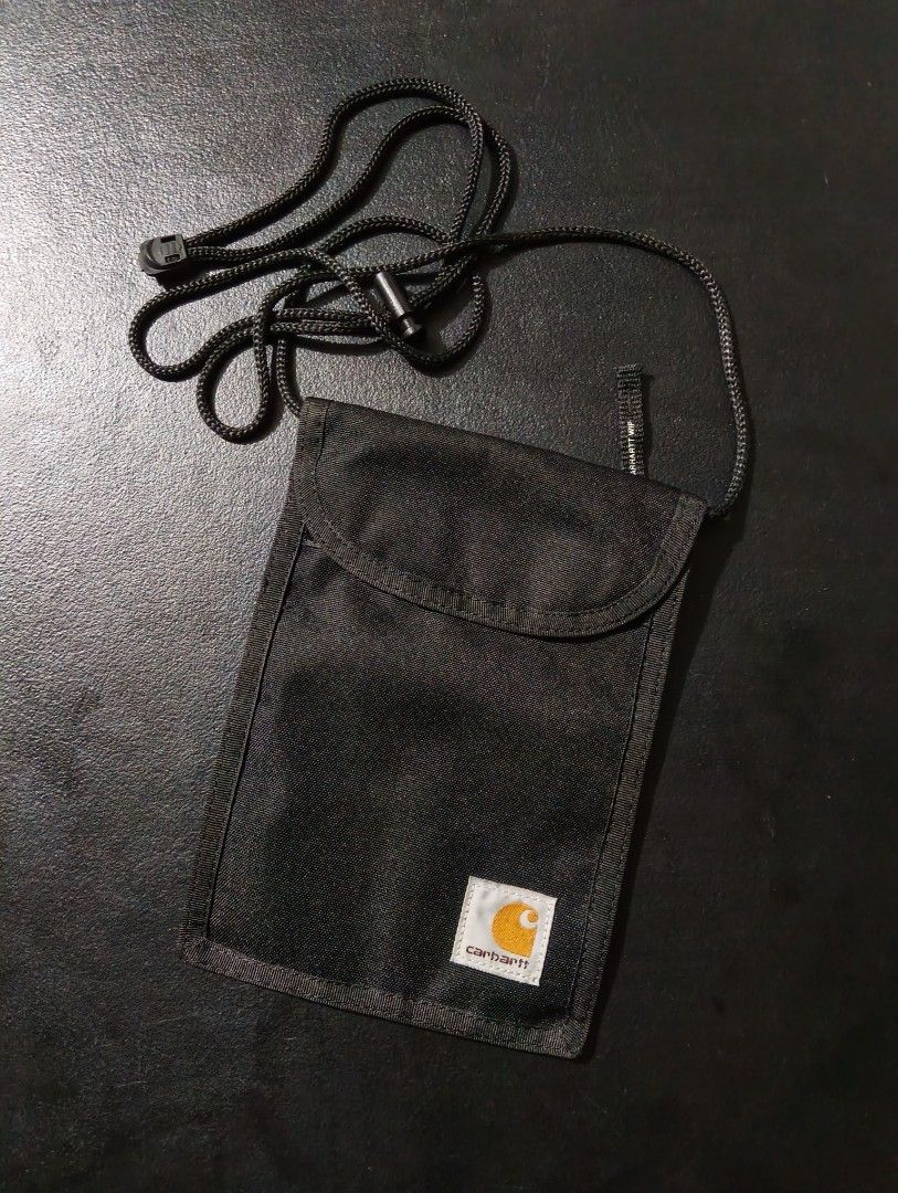 Carhartt WIP Collins Neck Pouch Black (Category: Belt bags, Clutches and Pouches) located in Manila. Submitted by fgkamiseta_2nd (Listing ID 1470461539, Image 1). Description: - Brand: Carhartt WIP Collins neck pouch - Color: Classic black canvas - Strap: Adjustable cord strap with secure toggle closure - Compartments: Main zip compartment, clear back card slot, and front flap with velcro closure - Branding: Authentic Carhartt square label on the