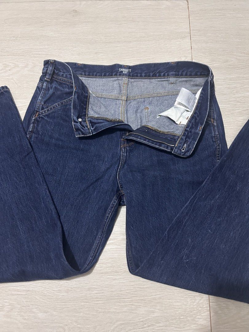 Carhartt WIP Denim Jeans (Category: Jeans) located in Bulacan. Submitted by friitzie (Listing ID 1470401766, Image 2). Description: - Brand: Carhartt WIP - Color: Dark blue - Closure: Button fly with branded hardware - Design: Classic five-pocket styling with rear logo patch - Bought in the US - Quality: Durable fabric and classic workwear construction - Condition: Clean look that pairs with any outfit.