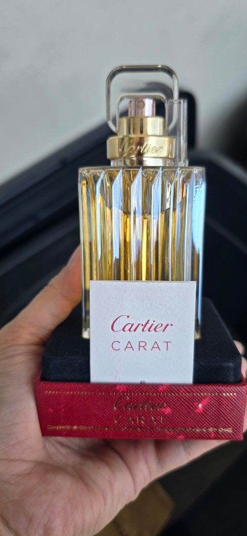 Cartier Carat Eau de Parfum 100ml (Category: Fragrance & Deodorants) located in Manila. Submitted by vi_ka (Listing ID 1470404612, Image 1). Description: - Authentic Cartier Carat perfume bottle with faceted glass design - Includes signature red textured Cartier box and introductory product card - Features a luxury gold spray nozzle with official Cartier branding - Perfect for collectors or as a gift Cartier Carat Perfume by Cartier, Cartier Cara