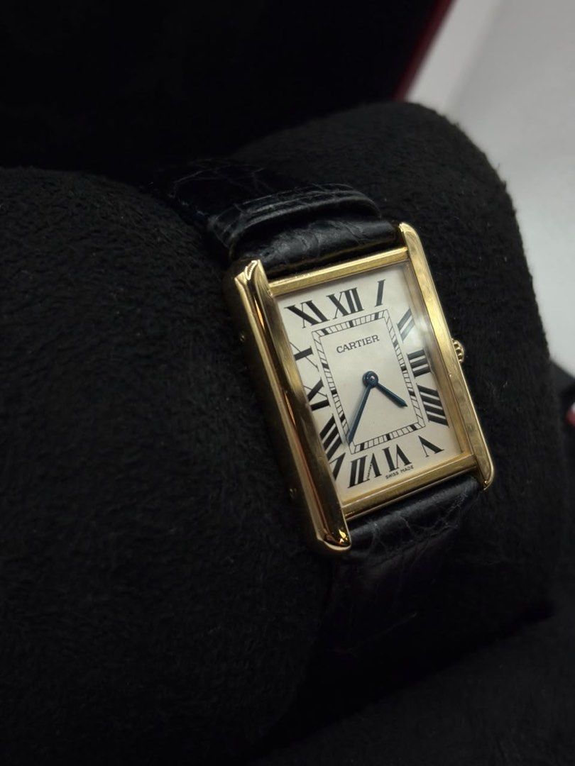 Cartier Tank Large YG (Category: Luxury Watches) located in Pasig City. Submitted by nicoestradaa (Listing ID 1470460112, Image 2). Description: Cartier Tank Large White roman dial 18k Yellow gold case and buckle 33.7mm x 25.5mm Leather strap W1018855 2017 year model 9.8/10 Complete set Open for authentication 350k.