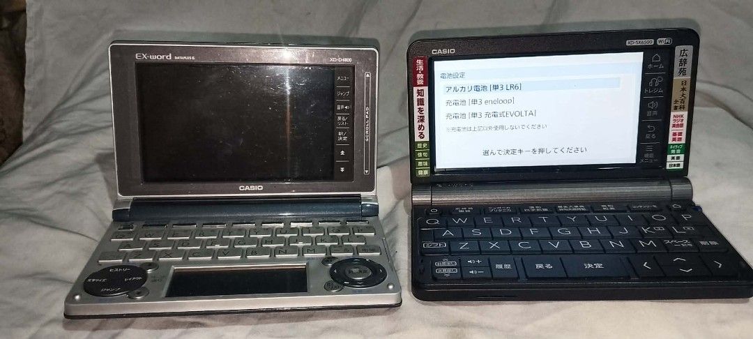 Casio Ex-word Electronic Dictionary Set XD-D4800 XD-SX6500 (Category: Office & Business Technology) located in Quezon City. Submitted by jpnvintageonline (Listing ID 1470503009, Image 3). Description: - Bundle includes 2 Casio Ex-word electronic dictionaries: XD-D4800 (Silver) and XD-SX6500 (Black) - Both units tested and power on -minor issue 1 unit no battery cover - Standard QWERTY keyboards with Japanese character input layouts - Clean screen