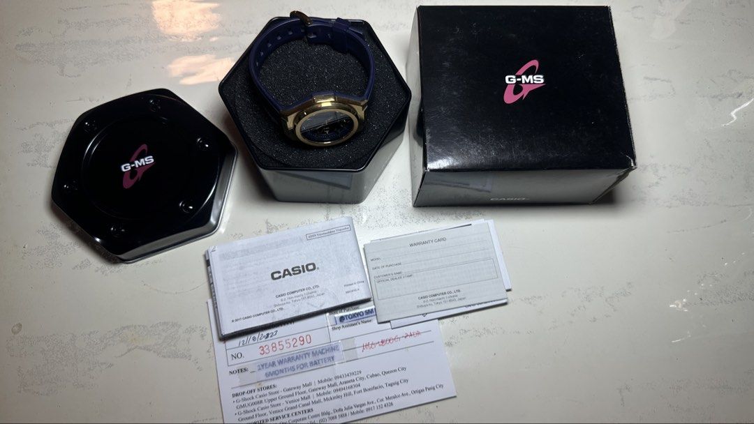 Casio G-MS MSG-S500G-2ADR Solar Powered Watch (Category: Women's Watches) located in Muntinlupa City. Submitted by clairebobot (Listing ID 1470503822, Image 2). Description: Casio G-MS solar powered watch, model MSG-S500G-2ADR. Gold tone bezel with dark blue dial and rubber strap. Includes original black presentation tin, outer box, manual, warranty card, and purchase receipt dated 12/8/2023 from Tokyo SM. Fully working order, kept in box..