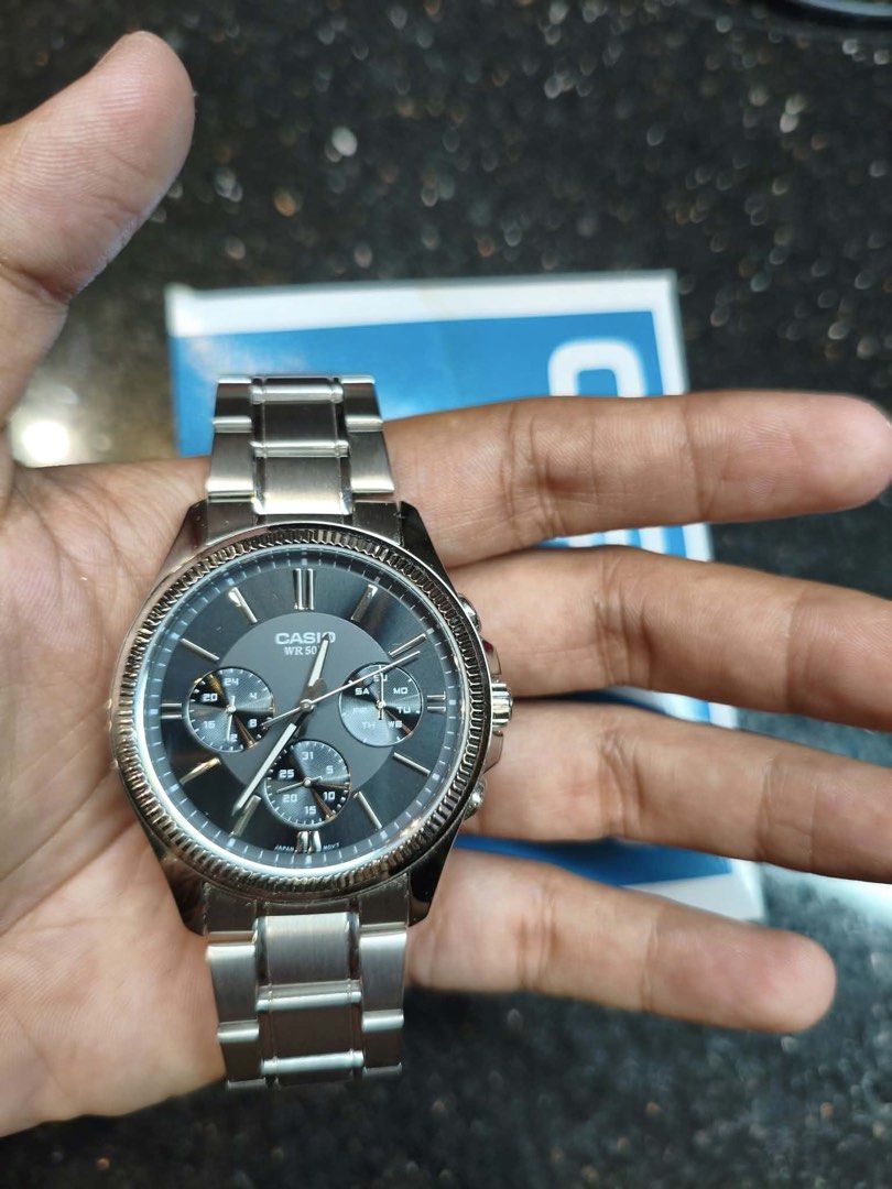 Casio MTP-1375 Stainless Steel Watch (Category: Men's Watches) located in Paranaque City. Submitted by engrmike (Listing ID 1470350185, Image 3). Description: - Model: Casio MTP-1375 - Dial: Textured black with multi-subdials (day, date, and 24-hour time) - Build: Durable stainless steel case and band with a fluted bezel detail - Movement: Reliable Japan movement (cased in China) - Water Resistance: Up to 50 meters - Inclusions: Original box and 