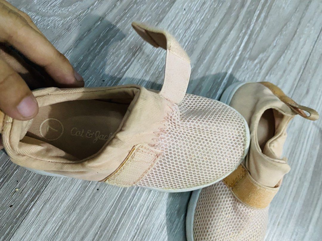 Cat & Jack Pink Mesh Slip-On Shoes (Category: Babies & Kids Fashion) located in Caloocan City. Submitted by lovemyclothes21 (Listing ID 1470455483, Image 3). Description: - Brand/Style: Cat & Jack toddler pink mesh slip-on sneakers - Size: Size 7 (marked on insole and sole, approx. 16.5 cm sole length) - Closure: Elastic strap with velcro for easy on and off - Material: Breathable mesh upper with durable rubber soles - Condition: Moderate wear on