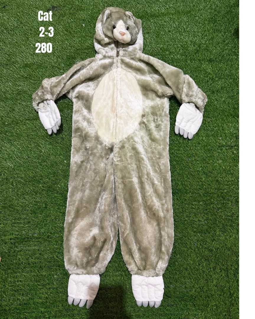 Cat Onesie Costume Age 2-3 (Category: Babies & Kids Fashion) located in San Fernando. Submitted by InvisibleMe (Listing ID 1470456199, Image 1). Description: - Adorable grey and white cat onesie costume - Full body jumpsuit with attached hood, cute cat face, and ears - Features sweet white paw details on hands and feet - Convenient front zipper closure for quick and easy changing - Ultra-soft plush material keeps kids warm and cozy - Perfect for 