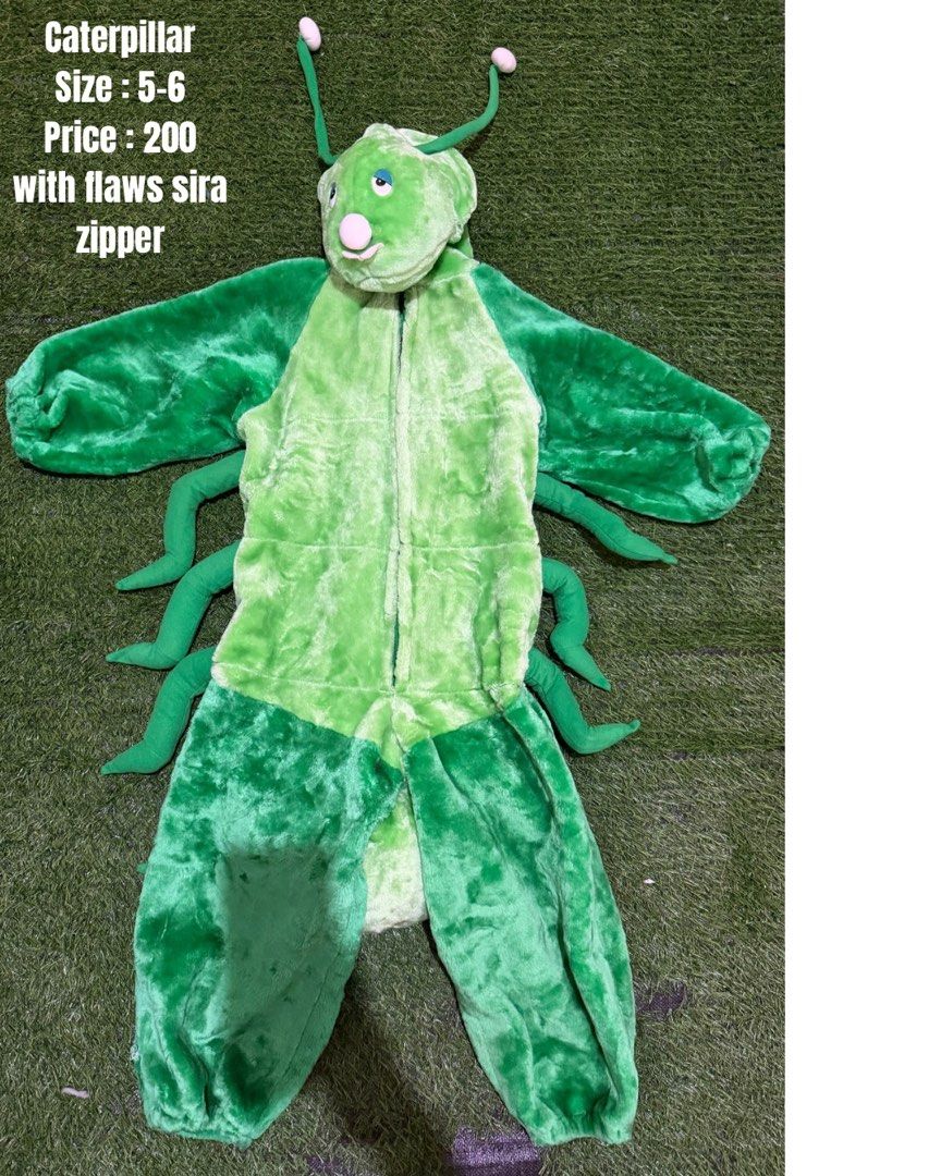 Caterpillar Costume Size 5-6 (Category: Babies & Kids Fashion) located in San Fernando. Submitted by InvisibleMe (Listing ID 1470449755, Image 1). Description: - Item: Green caterpillar costume for kids - Size: 5-6 - Material: Soft, fuzzy plush with attached legs and antennae hood - Condition: Broken zipper (needs repair) - Perfect for: Dress-up, school plays, and costume parties.