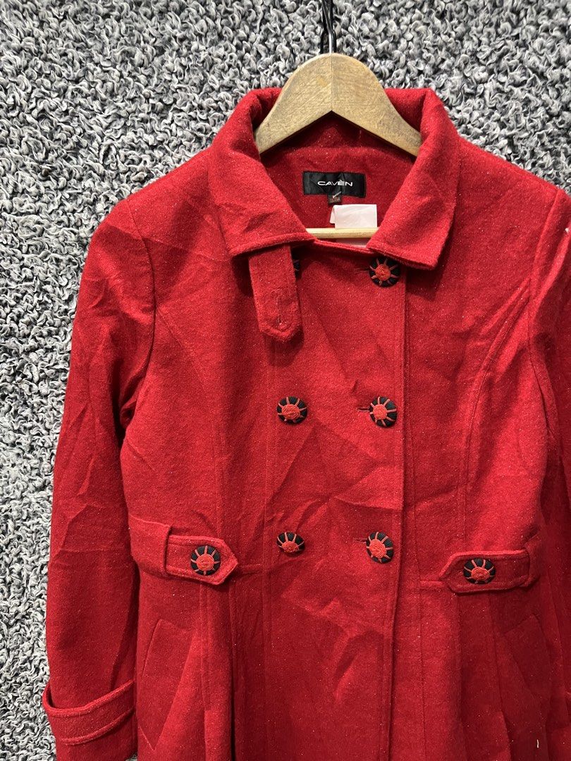CAVEN double-breasted coat | Size M (Category: Coats, Jackets and Outerwear) located in General Trias. Submitted by zrchustle.604 (Listing ID 1470457749, Image 2). Description: vibrant red, double-breasted coat branded by CAVEN. It features structured lapels, distinct custom-designed black and red accent buttons, a matching waist tab detailing, and a slight A-line flare toward the hemline..