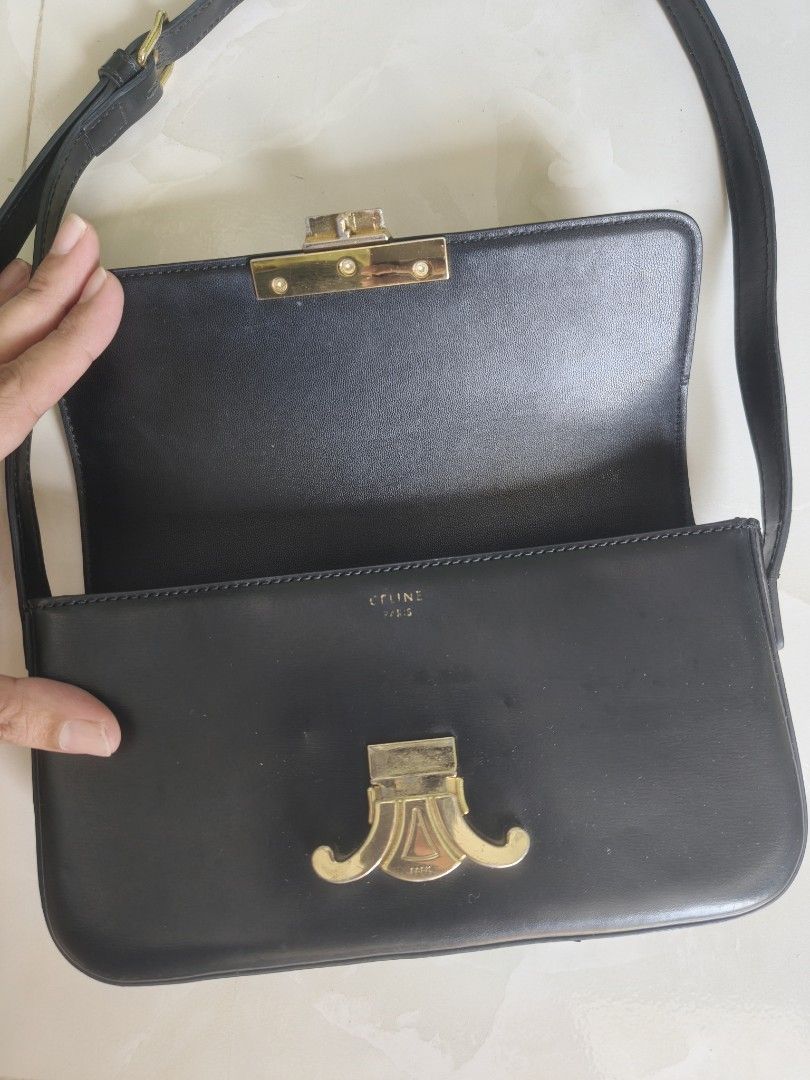 Celine Black Triomphe Shoulder Bag (Category: Luxury Bags & Wallets) located in Basud. Submitted by ClaireLavin (Listing ID 1470358197, Image 3). Description: Ukay Source, Coded but not guaranteed Issue: Strap, needs restitching please check photo Preloved condition, some scratches on hardware. .