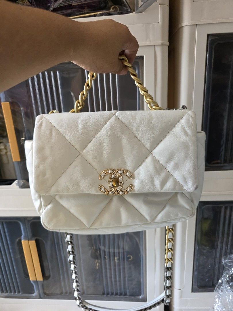 Chanel 19 Flap Bag White Quilted Leather (Category: Cross-body Bags) located in Lemery. Submitted by venus23 (Listing ID 1470363038, Image 1). Description: - Chanel 19 Flap Bag in timeless white quilted leather - Features striking mixed metal hardware in gold and ruthenium - Designed with a leather-woven chain strap and iconic CC turn-lock closure - Comes from a trusted Carousell seller – buy with confidence! - Send a message for inquiries or add