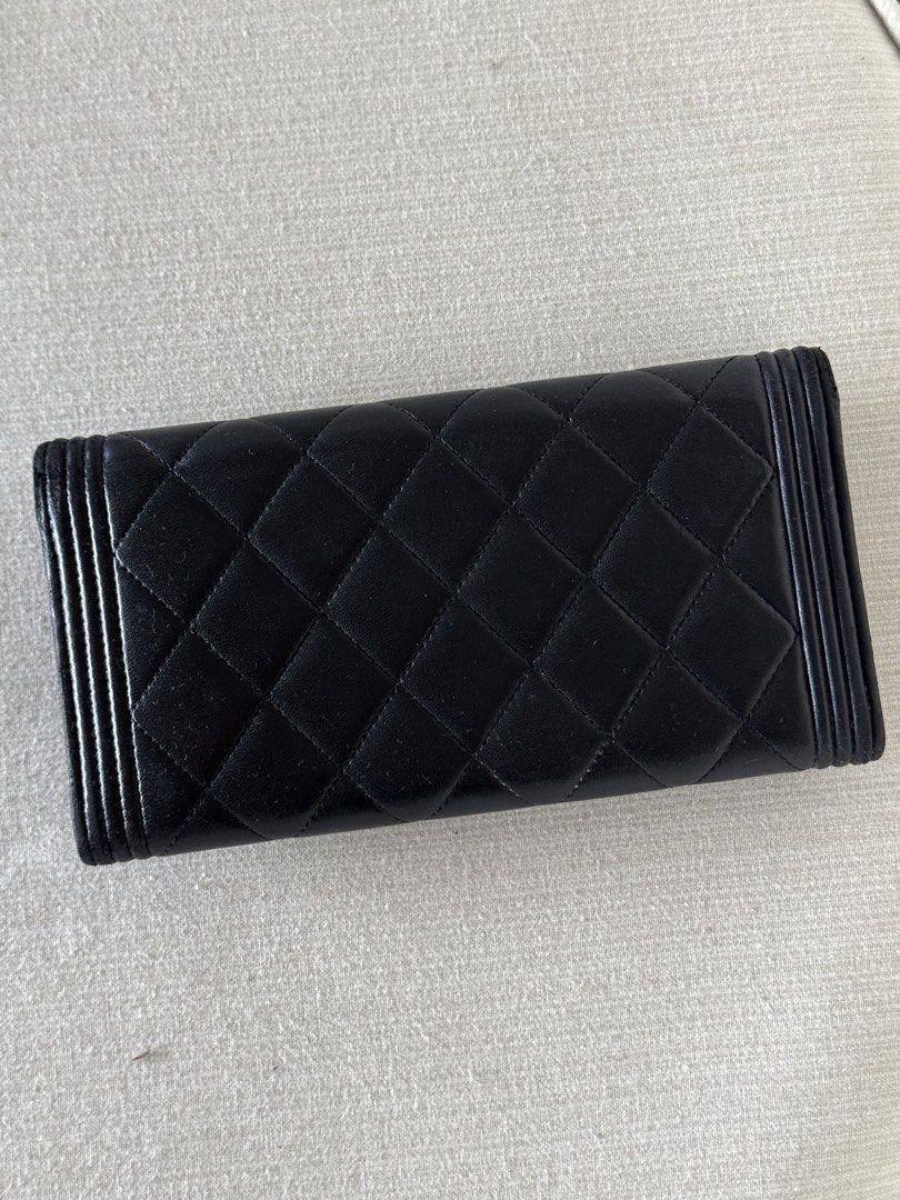 Chanel Boy Quilted Long Wallet Black Gold (Category: Luxury Bags & Wallets) located in Manila. Submitted by dc00.se (Listing ID 1470427248, Image 2). Description: - Brand: Chanel - Style: Le Boy Long Wallet - Material: Black quilted leather - Hardware: Gold tone with iconic CC push lock closure - Design: Structured rectangular shape with signature ribbed borders - Interior: Spacious layout for cards and cash organization - Condition: Used in good