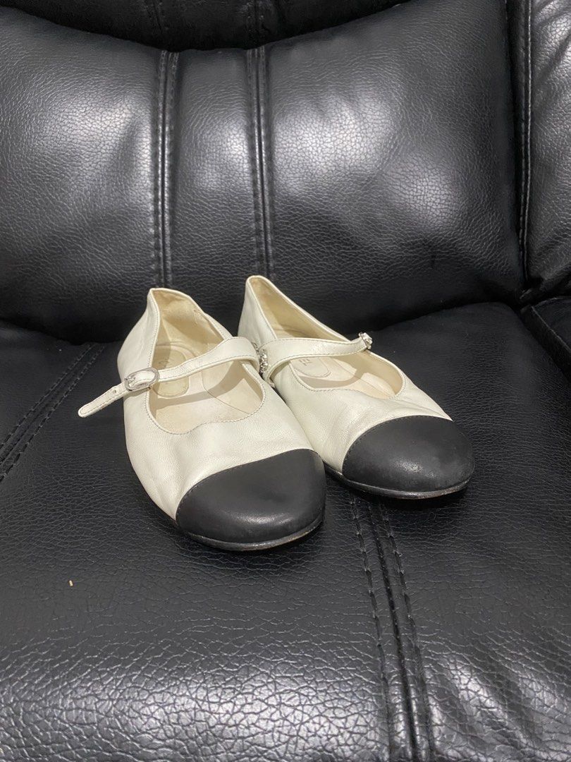 Chanel Mary Jane black toe Ballet Flats (Category: Sneakers & Footwear) located in Antipolo. Submitted by switchneighborhood (Listing ID 1470456255, Image 1). Description: - Authentic Chanel Mary Jane flats - White leather body with contrasting black round toe caps - Mary Jane strap featuring a stunning crystal-embrusted CC logo - Adjustable buckle closure stamped with the Chanel brand - Interior stamped with authenticity code numbers - Smooth in