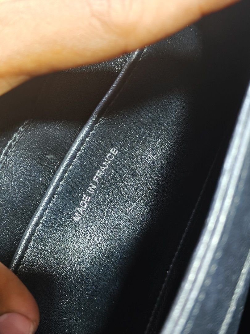 Chanel Quilted Black Leather Shoulder Bag (Category: Luxury Bags & Wallets) located in Davao. Submitted by navil01 (Listing ID 1470489321, Image 3). Description: - Chanel black quilted leather shoulder bag - Elegant chain strap threaded with matching leather - Front flap closure detailed with individual cylindrical beads spelling 'CHANEL' - Luxurious black leather interior lining equipped with a zipper pocket and slip pocket - Stamped 'Chanel Mad