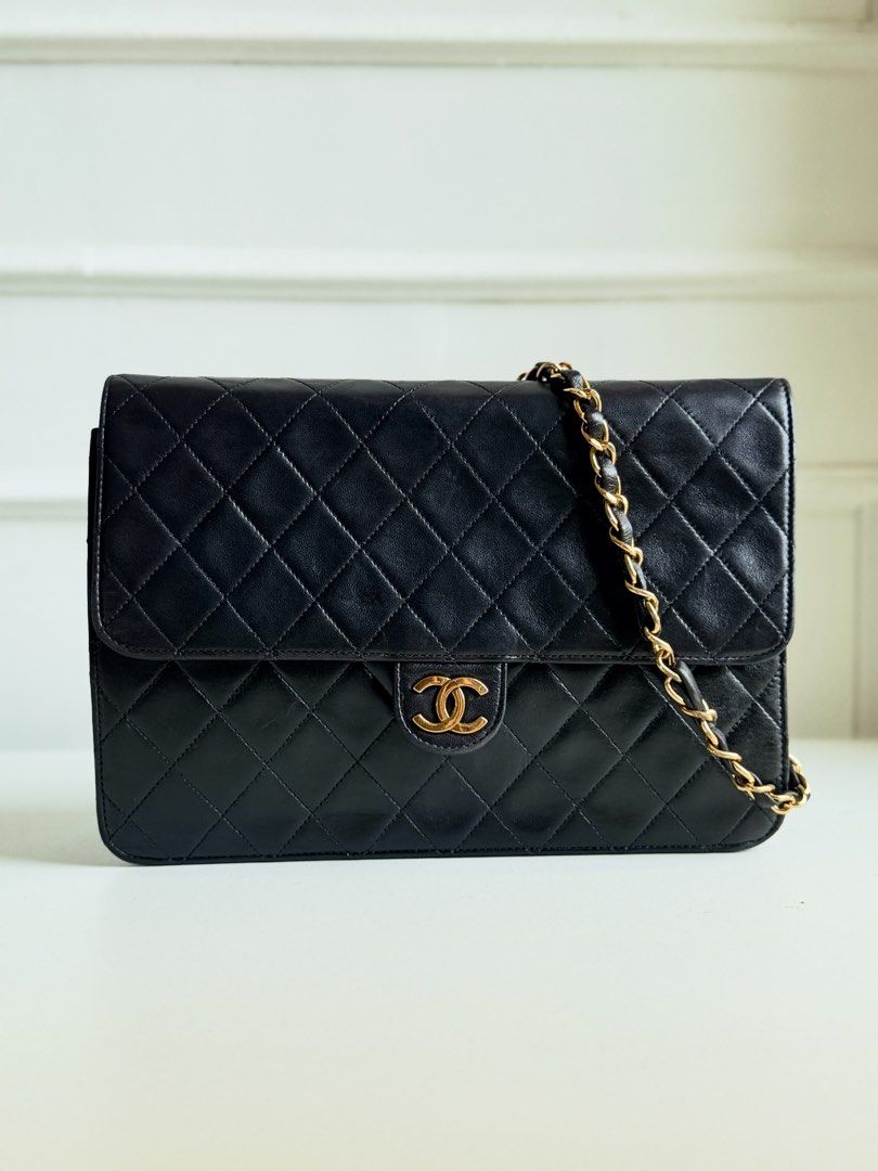 CHANEL Quilted Lambskin Flap Bag, Black (Category: Luxury Bags & Wallets) located in Tarlac. Submitted by official_kiyowo.vintage (Listing ID 1470472788, Image 2). Description: Material: Lambskin leather Hardware: Gold-tone Features: • Diamond-quilted leather • Signature CC detail on the flap • Leather-interwoven chain strap • Classic flap silhouette Condition: Pre-loved and in good overall condition, with visible creasing, surface marks, and sig