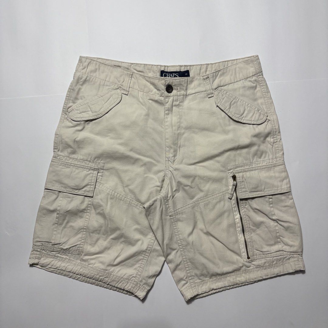 Chaps Cargo Shorts Beige Men's Size 33 (Category: Shorts) located in San Fernando. Submitted by lumang_gamit (Listing ID 1470397713, Image 1). Description: - Brand: Chaps - Color: Classic Beige - Size: 33 (Inner tag verified) - Material: Sturdy, durable cotton fabric - Pockets: Multiple utility pockets including buttoned back pockets and a secure zippered side pocket on the right leg - Closure: Front button closure with sturdy belt loops - Condit