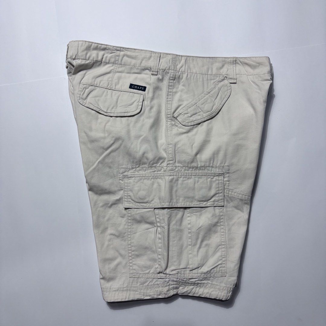 Chaps Cargo Shorts Beige Men's Size 33 (Category: Shorts) located in San Fernando. Submitted by lumang_gamit (Listing ID 1470397713, Image 3). Description: - Brand: Chaps - Color: Classic Beige - Size: 33 (Inner tag verified) - Material: Sturdy, durable cotton fabric - Pockets: Multiple utility pockets including buttoned back pockets and a secure zippered side pocket on the right leg - Closure: Front button closure with sturdy belt loops - Condit